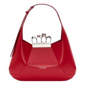 Elegant red handbag featuring unique ring detail.