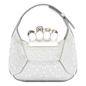 White handbag featuring jeweled handle rings