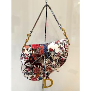 Floral patterned handbag with gold accents