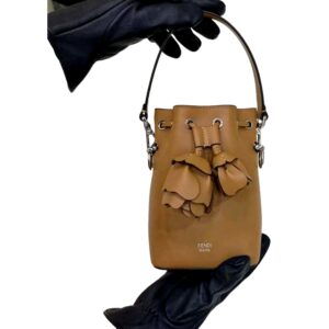 Tan handbag with floral accents