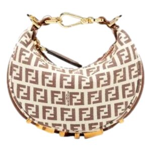 Designer monogram handbag with gold accents