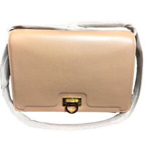 Stylish beige bag featuring gold hardware
