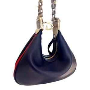 Stylish navy purse with metal accents.