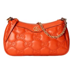 Trendy orange bag featuring gold accents