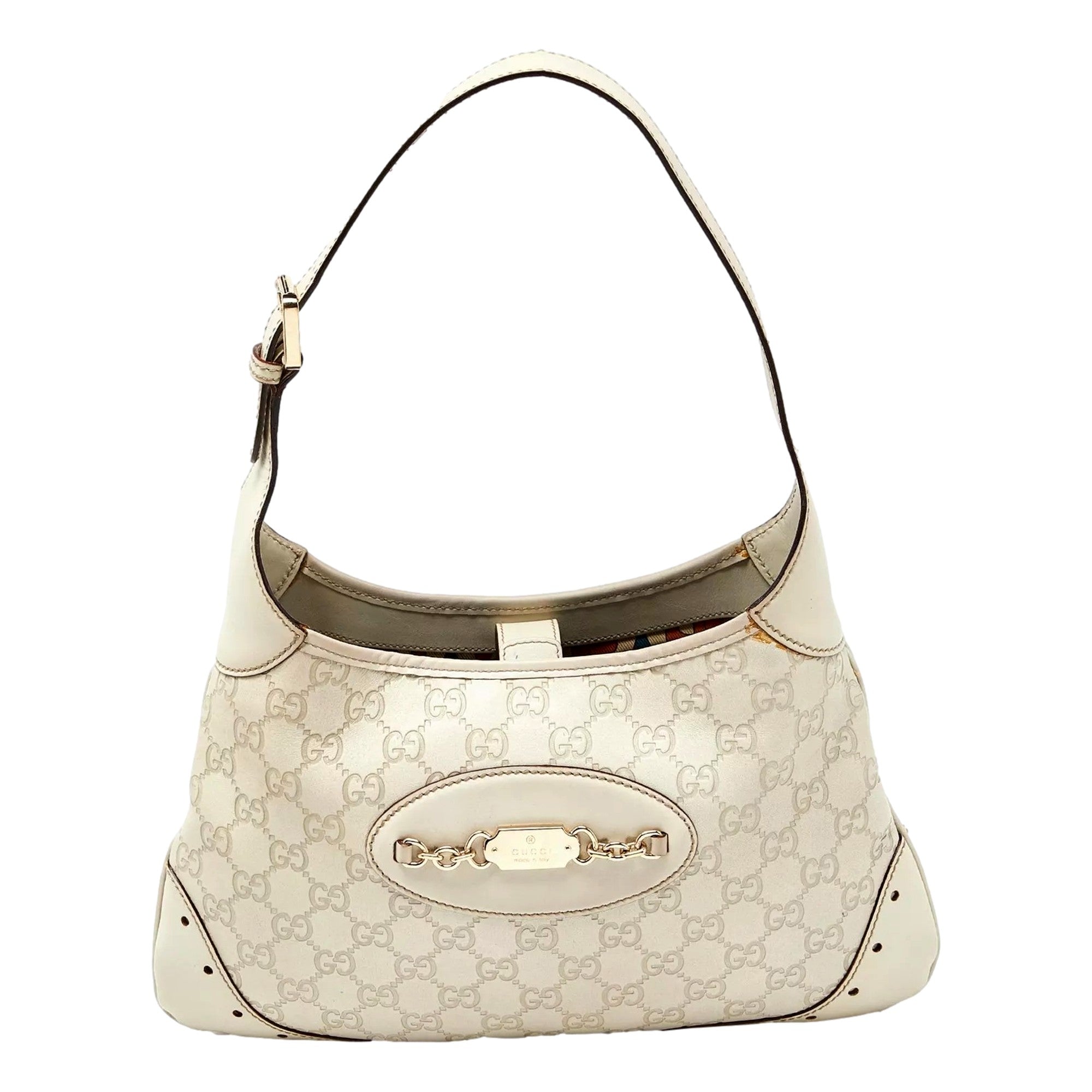 Beige designer handbag with shoulder strap