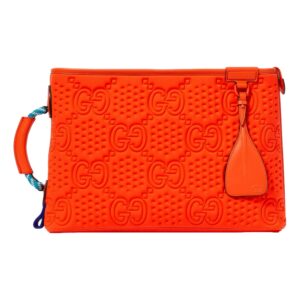 Orange designer handbag with embossed pattern