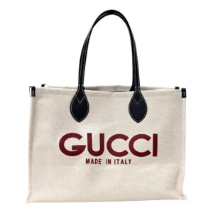 Beige Gucci bag with red logo