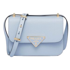 Blue designer handbag with gold accents