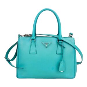 Stylish turquoise bag with silver hardware