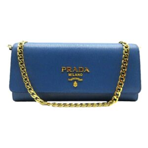 Prada purse featuring gold accents