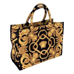 Ornate black and gold patterned handbag