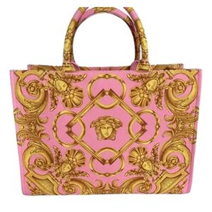 Pink handbag with ornate golden pattern