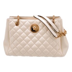 Quilted cream handbag with gold chain straps.