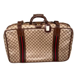 Designer luggage with striped detail